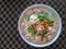 Vietnamese Rice Noodle Soup with pork chopped and sausage