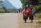 Vietnamese schoolkids walking home on a country road