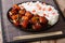 Vietnamese spicy caramel pork belly with rice closeup on a table