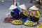 Vietnamese vendors selling fruit and vegetables at Dalat market