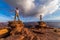 A Vietnamese woman in her wedding dress poses with her groom in the barren desert of Moab, Utah