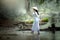 Vietnamese woman holding cart walking for sale vegetables