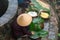 Vietnamese woman preparing to make Chung Cake, the Vietnamese lunar new year Tet food outdoor by old well and pond