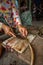 Vietnamese woman slices eels