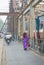 Vietnamese woman in traditional dress Ao Dai walking on old Long Bien bridge, Hanoi city