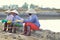 Vietnamese women salt workers are relaxing after working hard to collect salt from the extract fields to the storage fields