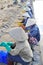 Vietnamese women salt workers are relaxing after working hard to collect salt from the extract fields to the storage fields