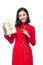 Vietnamese young woman in Ao Dai dress holding gift box.