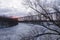 View of the 1908 railway trestle bridge over the Cap-Rouge River seen during a cloudy winter sunrise