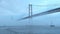 View of 25 de Abril Bridge famous tourist landmark of Lisbon in heavy fog mist