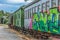 View of a abandoned older rustic train, wagon with graffiti street art