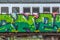 View of a abandoned older rustic train, wagon with graffiti street art