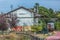 View of a abandoned train station, building and older rustic train, wagon with graffiti street art