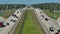 View from above of american wide freeway in Florida with dense traffic of driving cars during rush hour. USA