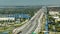 View from above of American wide freeway in Miami, Florida with dense traffic of driving cars during rush hour. USA