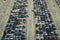 View from above of big parking lot with parked used cars after accident ready for sale. Auction reseller company selling