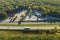 View from above of big parking rest area for cars and trucks near busy american highway with fast moving traffic