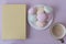 View from above. Book, sweets, cocoa. Cozy picture. Place for text on the book. Pastel shades. Interesting book and