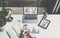 View from above,businesswoman sitting at desk,using smartphone,working.