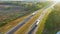 View from above of busy american highway with fast moving trucks and cars. Interstate transportation concept