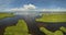 View from above of Florida everglades with green vegetation between ocean water inlets. Natural habitat of many tropical