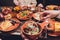 View from above of georgian cuisine on brown wooden table.Traditional georgian food-khinkali,kharcho,chahokhbili,phali