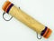 View from above of handmade wooden rain stick on white background. Peruvian instrument. Concept percussion instruments