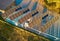 view above innovative solar panels located on a car parking lot rooftops making good use of small space in a city for electric car