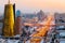 A view from above on a large avenue that goes down to the horizon, and a golden skyscraper of minestry in Astana, Kazakhstan