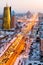 A view from above on a large avenue that goes down to the horizon, and a golden skyscraper of minestry in Astana, Kazakhstan