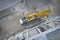 View from above on large heavy truck crane in front of concrete scaffolding