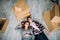 View from above, looking at the camera a young couple lying on the floor of their new home