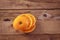 View from above on the luscious orange tangerine that lies on wooden boards