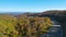 View from above of national freeway route in North Carolina leading thru Appalachian mountains with yellow fall woods