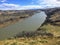 A view above of the Old Man River cutting through the valley and plains of Lethbridge, Alberta, Canada