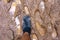 View from above on pair of trekking shoes in a mud, Hiking boots stuck in mud