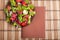 View from above on a plate with fresh salad of raw tomatoes