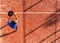 View from above of a professional paddle tennis player who has just hit the ball