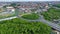 View from above of ring road toll way structure blend with group of green tress on the side