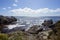 View from above a rocky cove westward into the horizon above the California Pacific