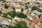 View from above on the streets and roofs of the houses of a modern European city. Athens summer day from a height.