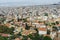 View from above on the streets and roofs of the houses of a modern European city. Athens summer day from a height.