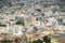 View from above on the streets and roofs of the houses of a modern European city. Athens summer day from a height.