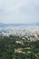 View from above on the streets and roofs of the houses of a modern European city. Athens summer day from a height.