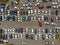 A view from above to the lines of parked cars. Heavy traffic in the parking lot. Searching for spaces in the busy car park.