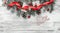 View from above, top, on a white wooden board background with fir branch with pines, present boxes, ribbon, red tree globes