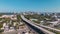 View from above of USA transportation infrastructure. Aerial view of American elevated freeway with fast driving cars
