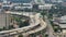 View from above of USA transportation infrastructure. Aerial view of American highway with fast driving vehicles in