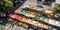 A view from above of a vibrant and organized farmers market, showcasing diverse local products and ingredients, concept