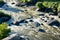 View from above on the waters of a mountain river flowing through stones